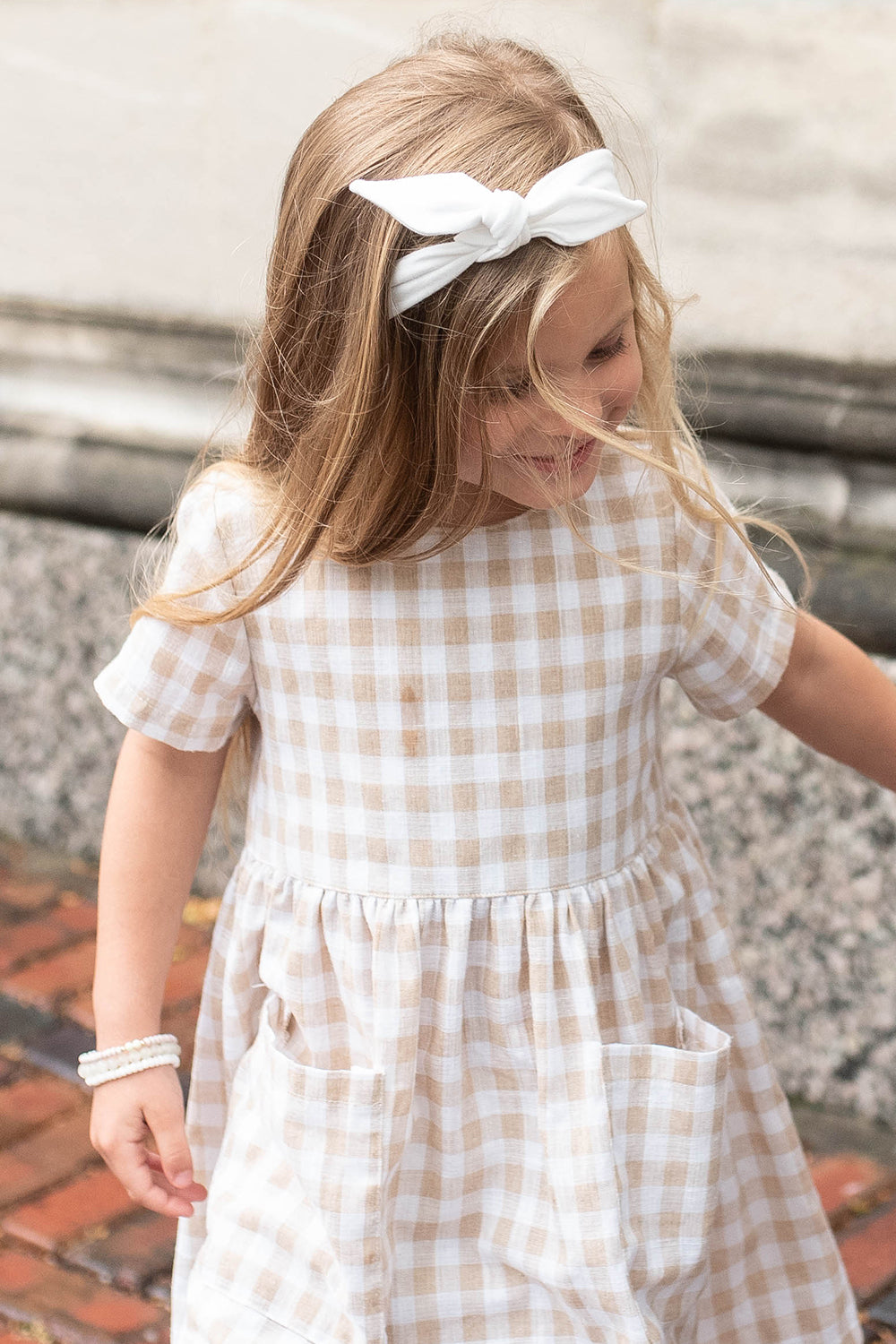 Toddler white headband with bow.