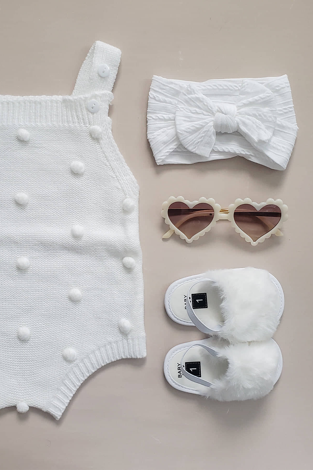 Baby romper with headband.