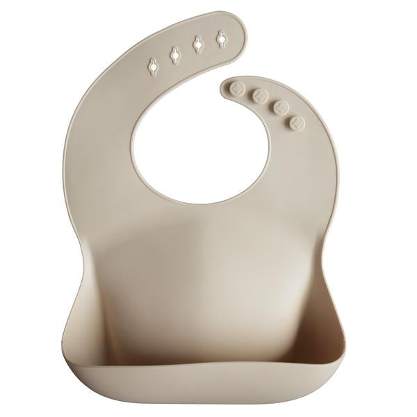 beige sand mushie silicone baby bib