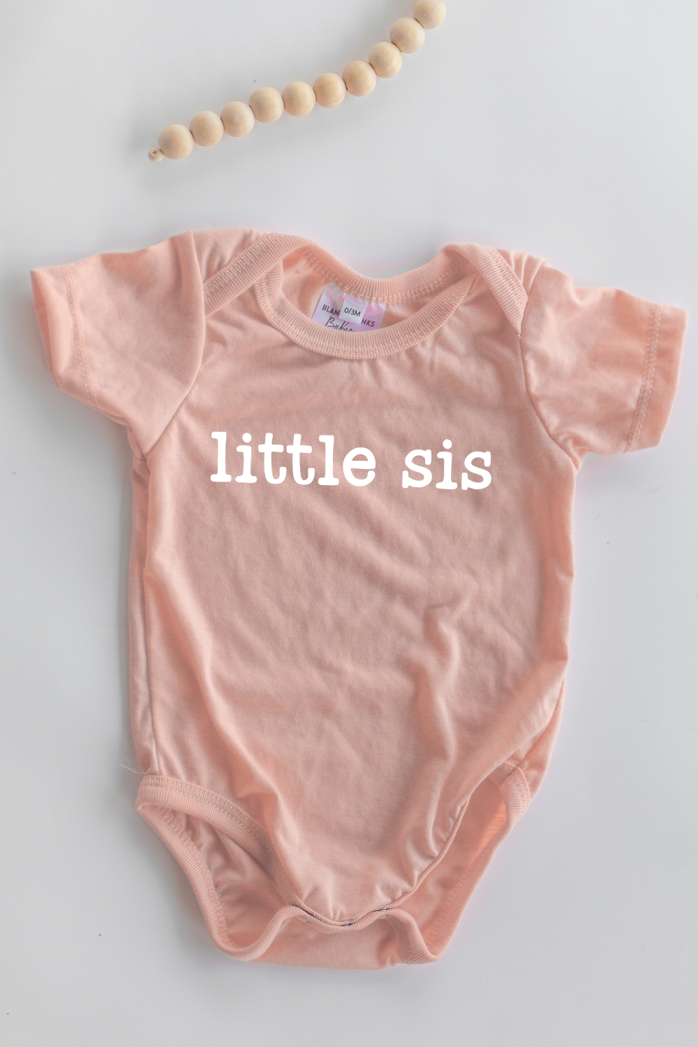 peach little sis onesie