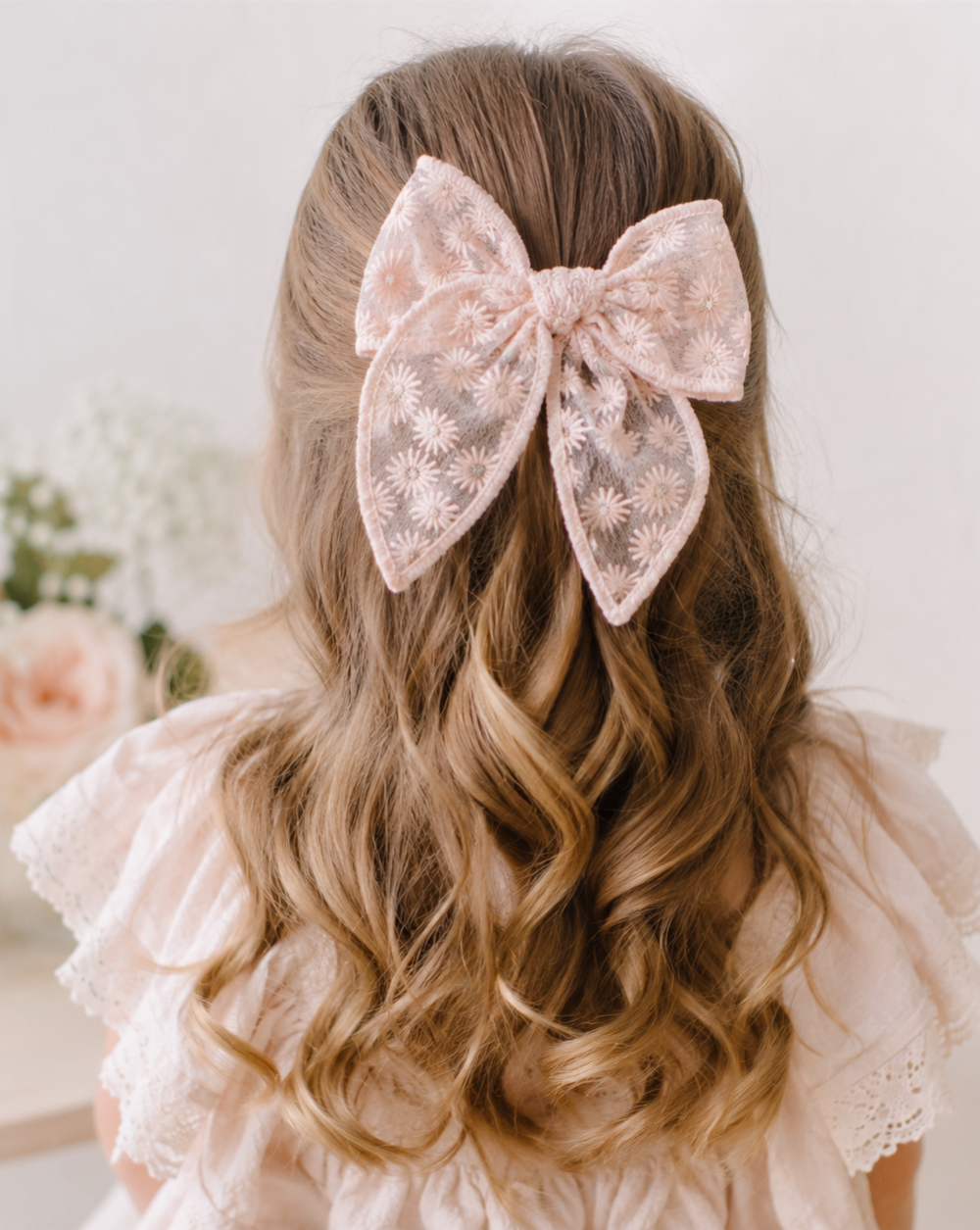 girly hairstyle with floral lace bow
