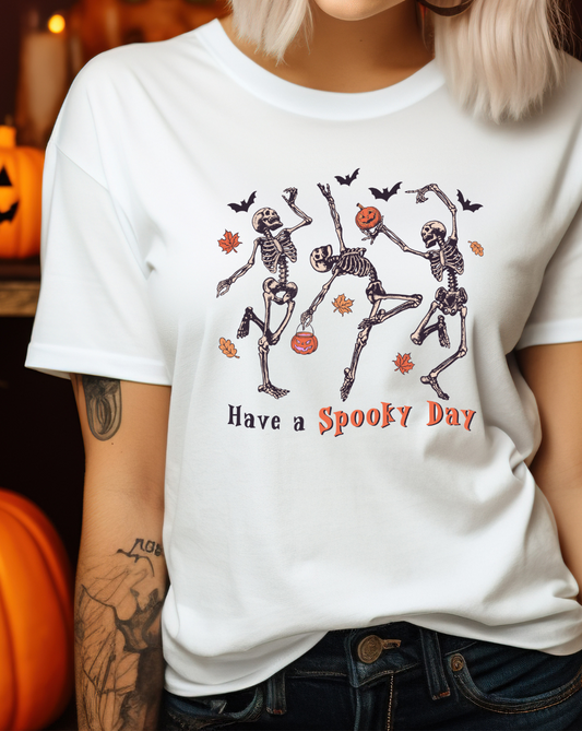 have a spooky day womens halloween t shirt with skeletons holding pumpkins and dancing. bats flying.