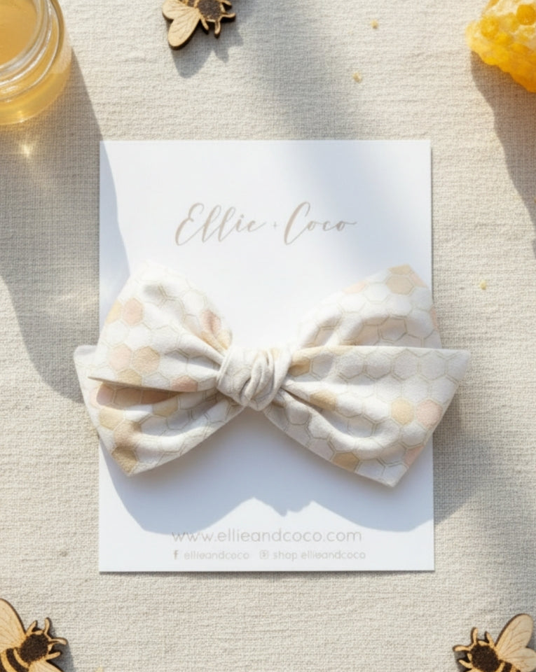 honeycomb baby bow for bee first birthday cake smash photoshoot