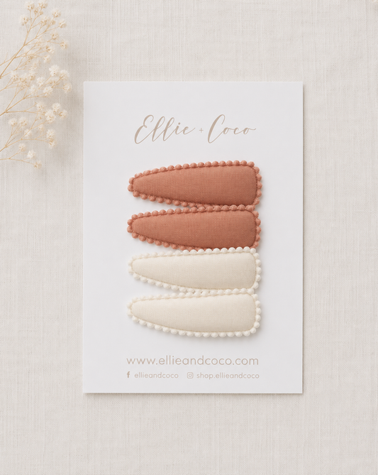 pink and white scallop edge snap clips for baby and toddler girls