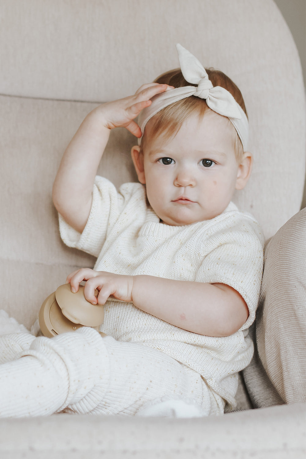 Baby wearing headband.