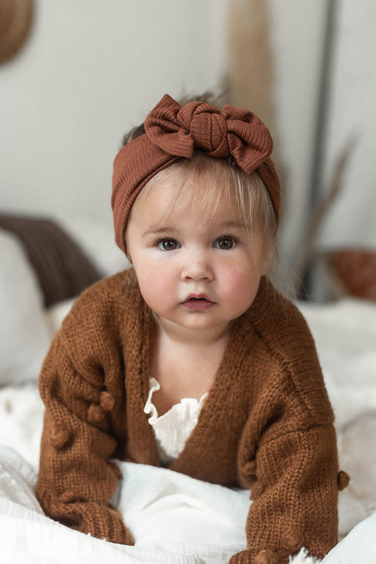Ribbed Baby headband with bow.