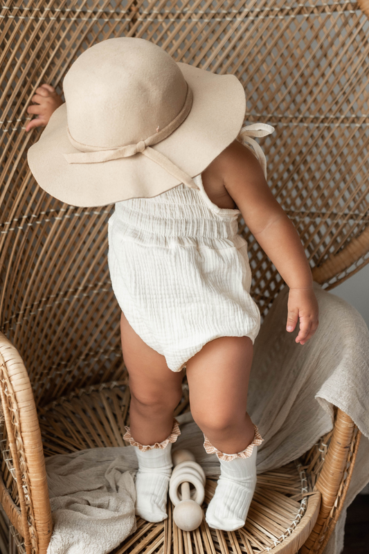 Baby romper and hat set.